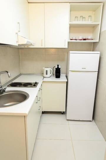 Фото номера Two-Bedroom Apartment- semi-basement Апарт-отели Villa Casafina Serviced Apartments г. Мангалия 7